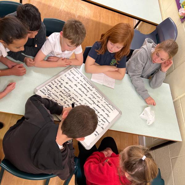 School Children Sat At Table